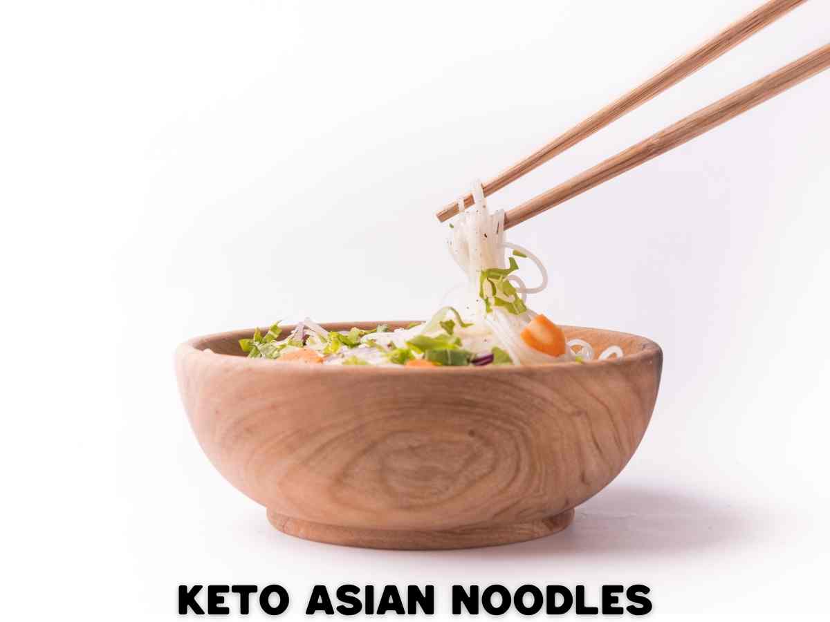 10 Delicious Keto Noodles To Swap Your Carby Pasta For a wooden bowl with keto asian noodles with chop sticks