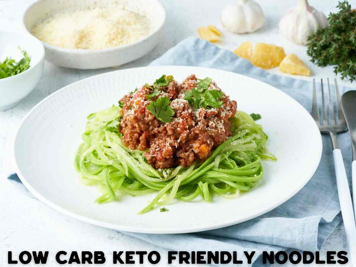 10 Delicious Keto Noodles To Swap Your Carby Pasta For plate of veggie low carb keto noodles with sauce and protein