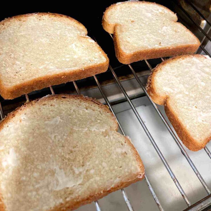 Easy Keto Toast Recipe with Just 2 Net Carbs Per Slice Low carb keto toast in the oven, buttered and broiling on the rack for a crisp and golden finish